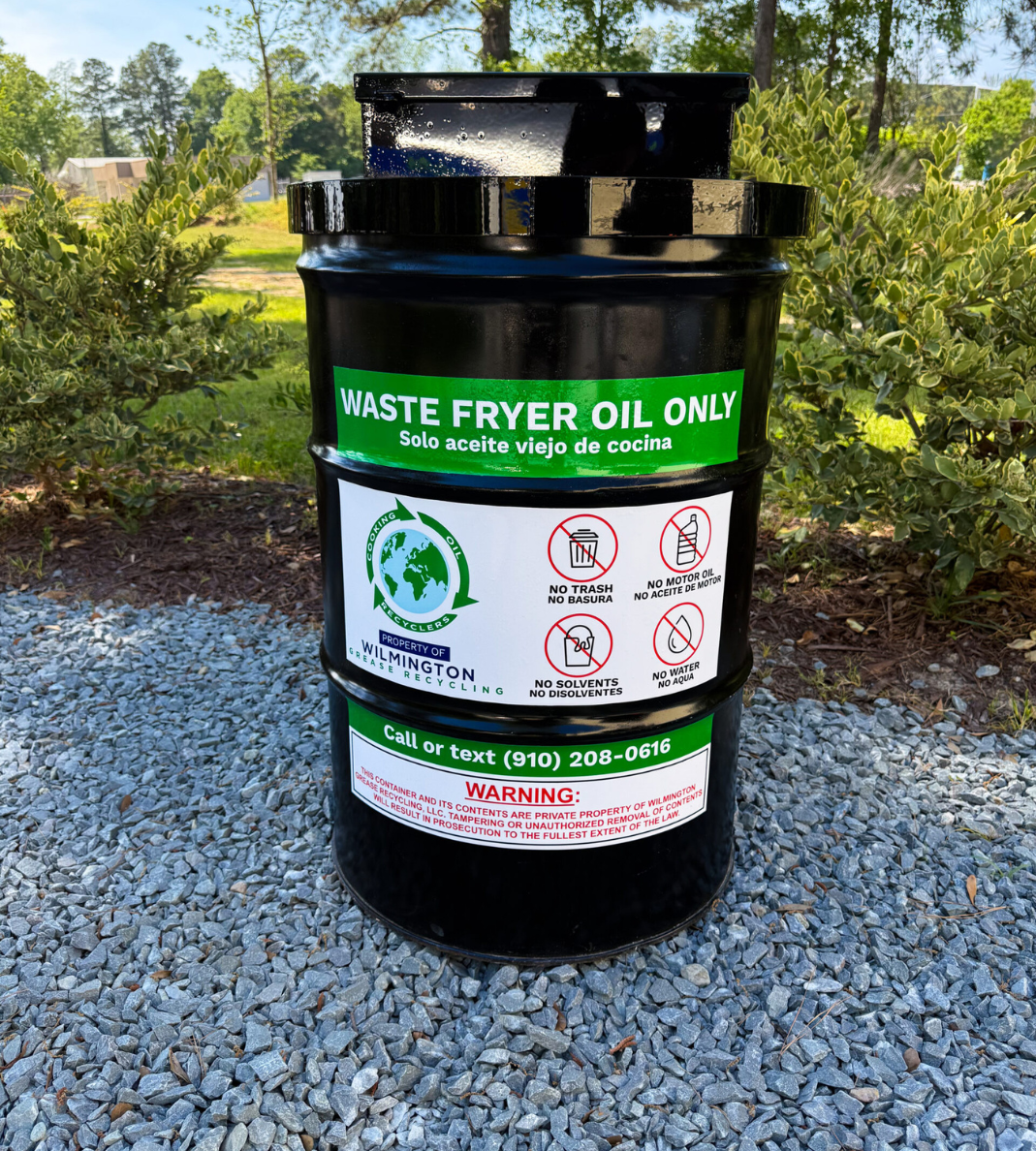 Grease Container & Bin Management 6 Black waste fryer oil recycling container labeled for used cooking oil collection outdoors.